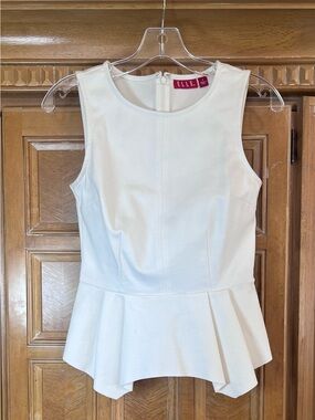 Elle White Sleeveless Peplum Blouse